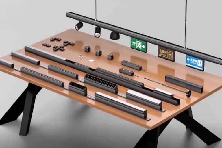 LED strip and profile lighting components displayed on a wooden table for professional commercial lighting solutions.